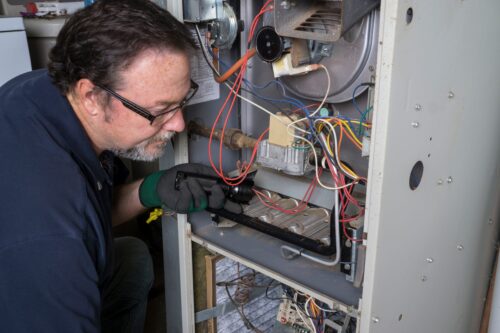 Tech working on furnace in Monroe Township, NJ.